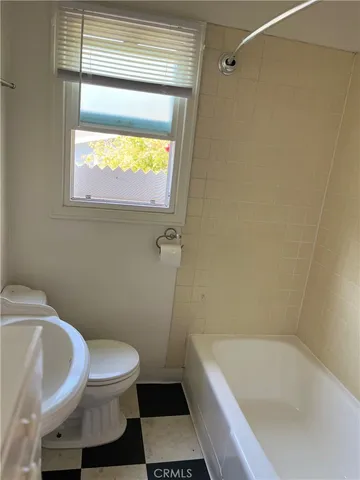 a bathroom with a bathtub and sink