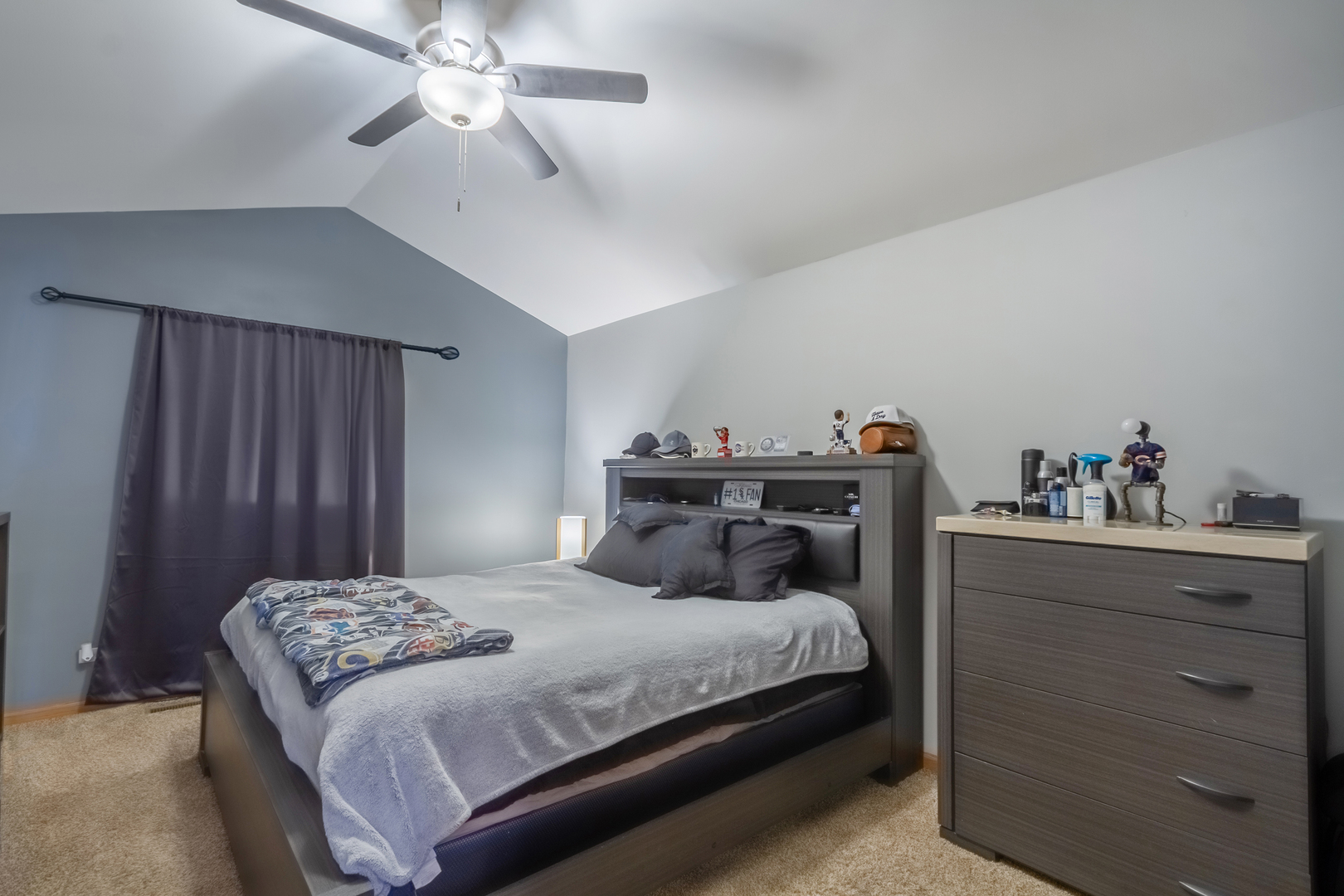 10909 Cape Cod Lane Huntley, IL 60142 - Photo 11 of 18 a bedroom with a bed and a chandelier