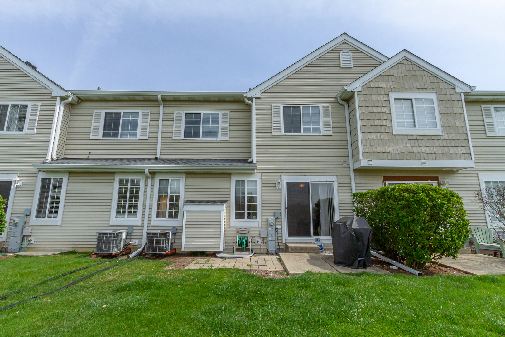 10909 Cape Cod Lane Huntley, IL 60142 - Photo 17 of 18 a view of a house with a yard and a large tree