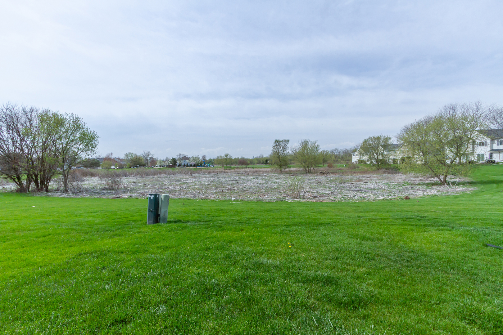 10909 Cape Cod Lane Huntley, IL 60142 - Photo 18 of 18 a view of a lake with houses in the back