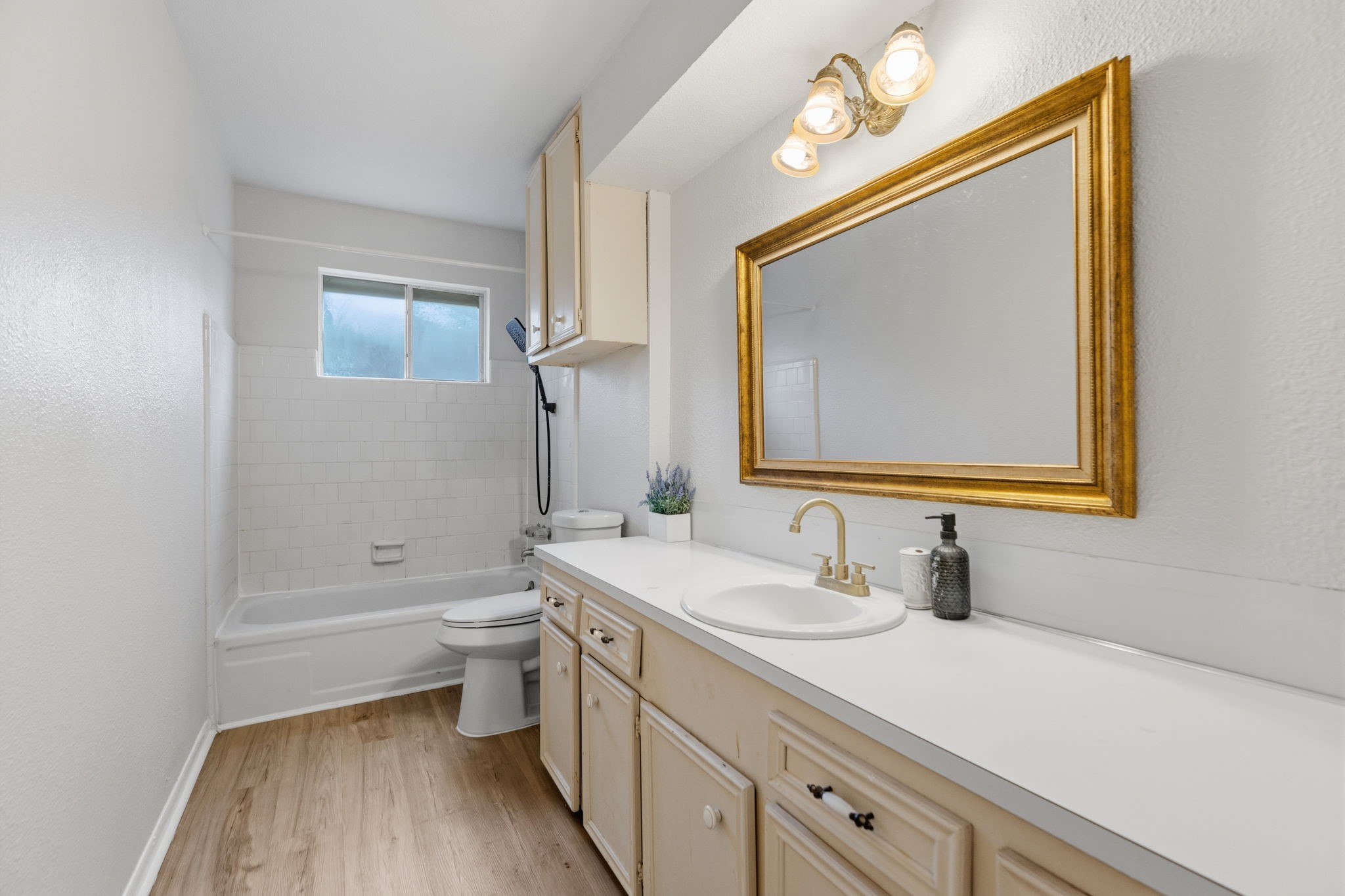 9618 Rannock Way Spring, TX 77379 - Photo 19 of 24 a bathroom with a double vanity sink toilet mirror and bathtub