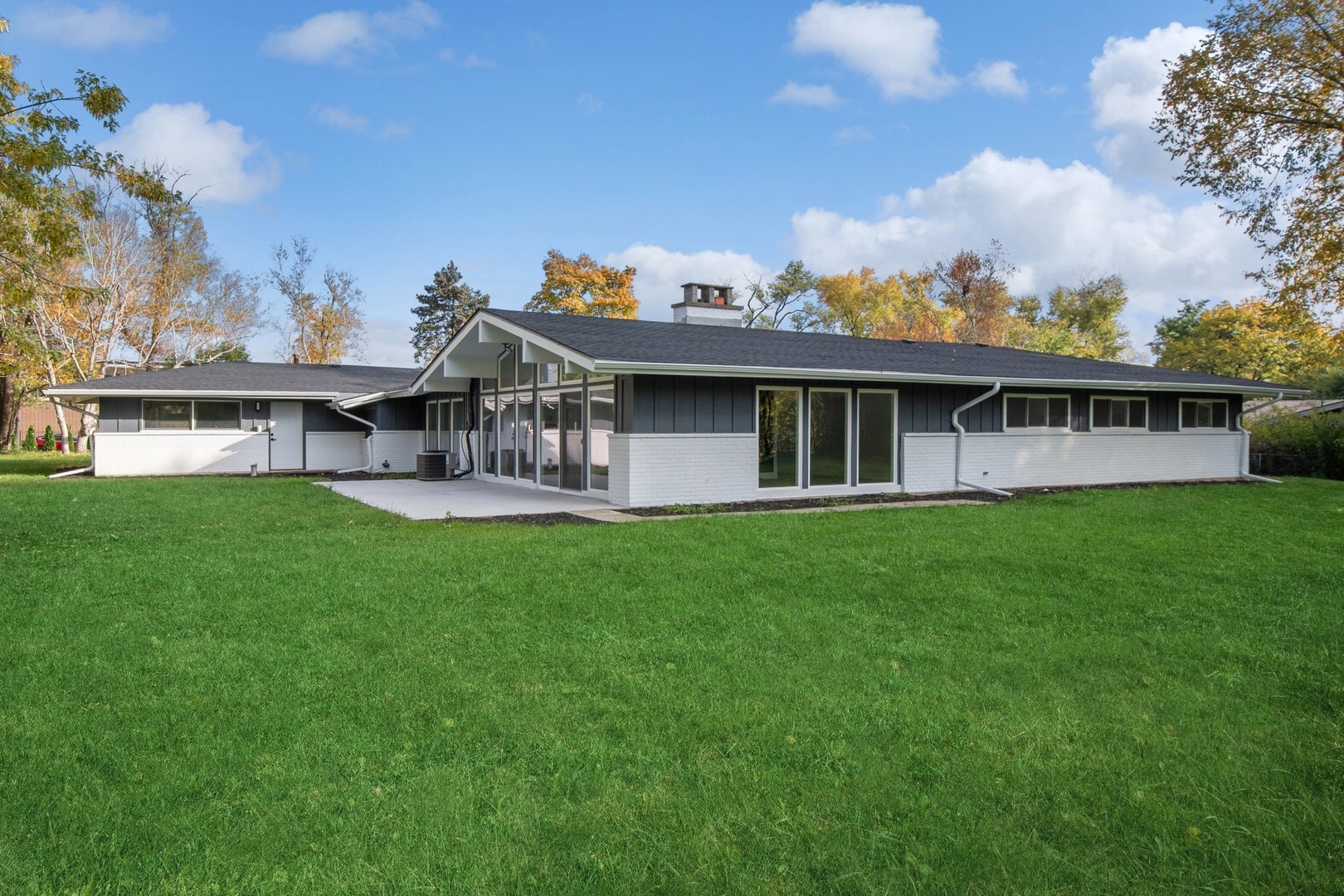 3131 Willow Road Northbrook, IL 60062 - Photo 1 of 23 a view of a house with a big yard and large trees