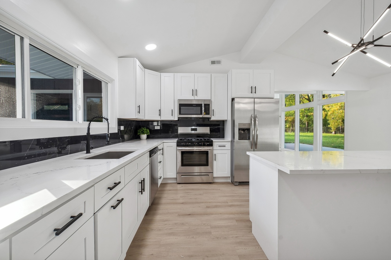 3131 Willow Road Northbrook, IL 60062 - Photo 11 of 23 a kitchen with stainless steel appliances a stove sink microwave and refrigerator