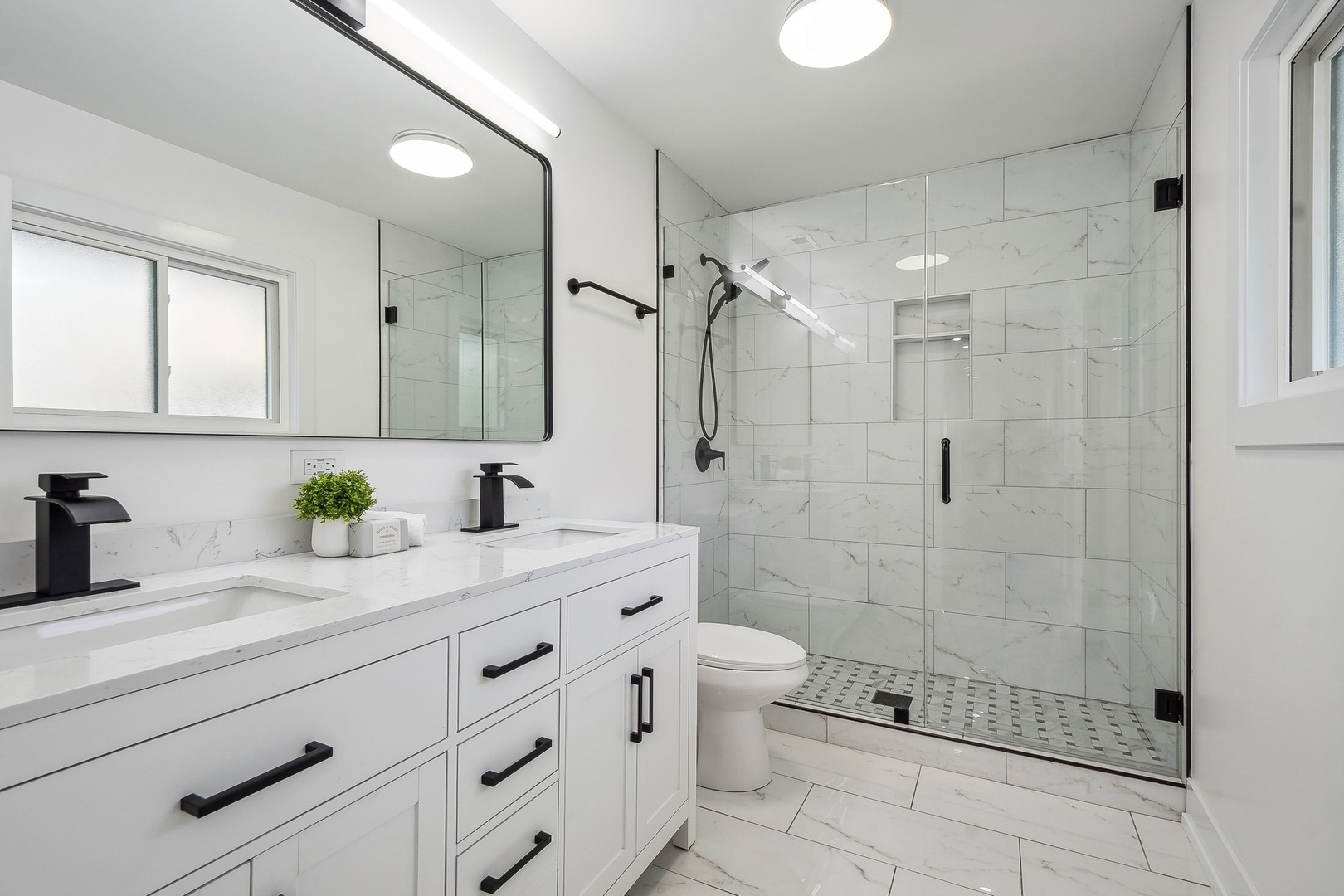 3131 Willow Road Northbrook, IL 60062 - Photo 16 of 23 a bathroom with a granite countertop sink a toilet and shower