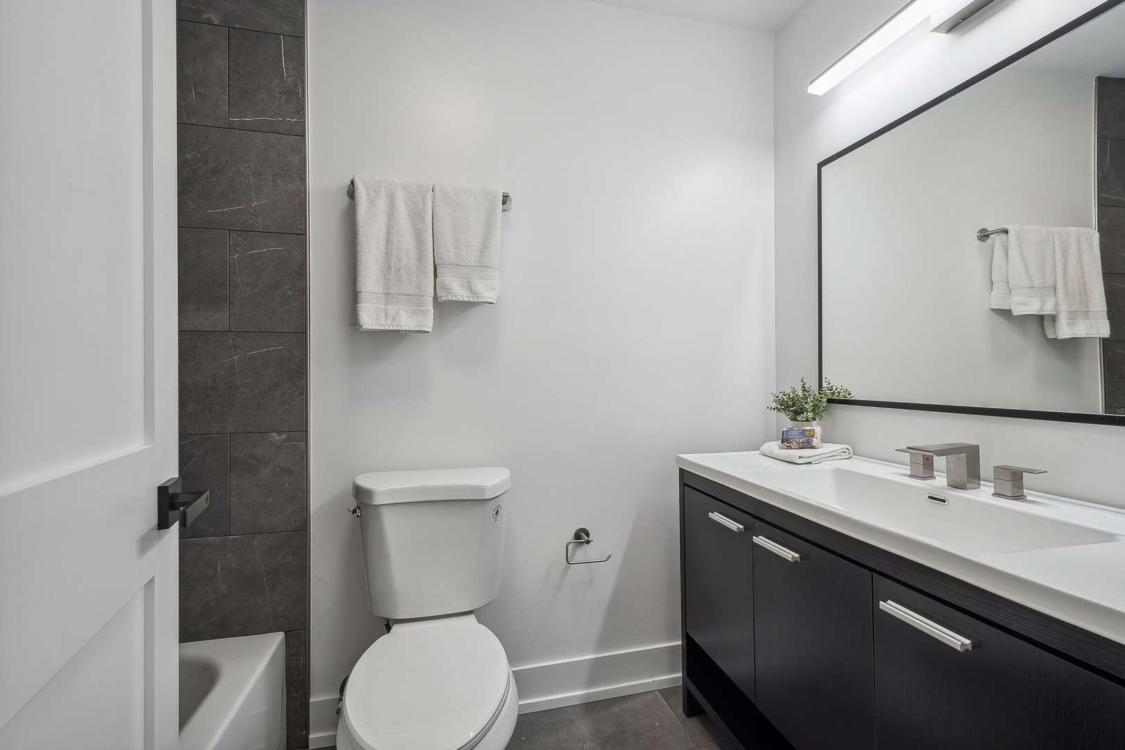3131 Willow Road Northbrook, IL 60062 - Photo 19 of 23 a bathroom with a toilet sink and mirror