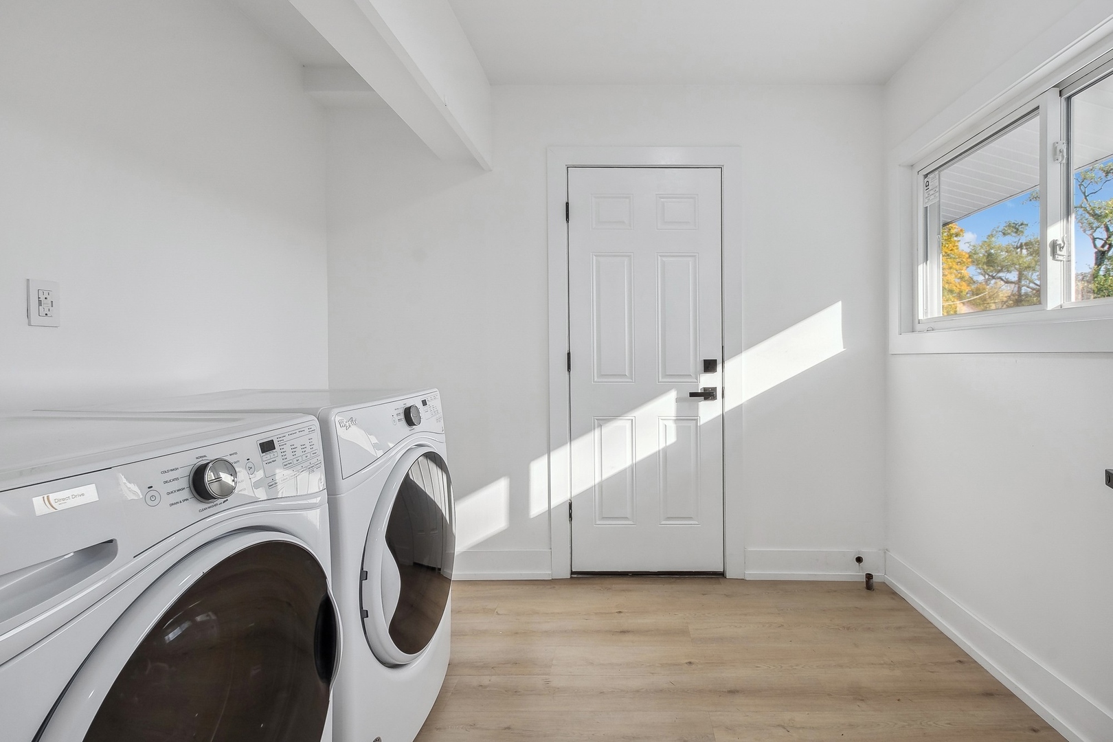 3131 Willow Road Northbrook, IL 60062 - Photo 20 of 23 a view of storage and utility room with washer and dryer