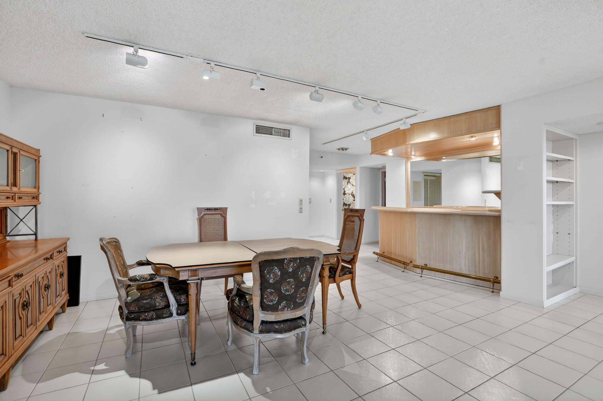 7564 Regency Lake Drive, Unit 701 Boca Raton, FL 33433 - Photo 12 of 47 a view of a dining room with furniture