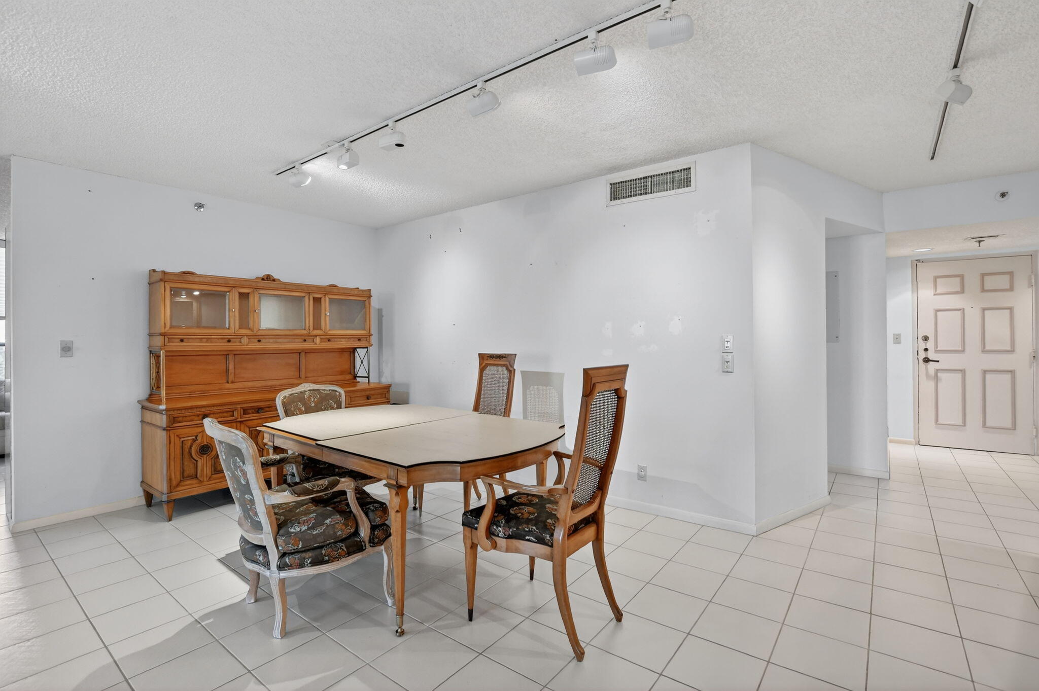 7564 Regency Lake Drive, Unit 701 Boca Raton, FL 33433 - Photo 13 of 47 a view of a dining room with furniture