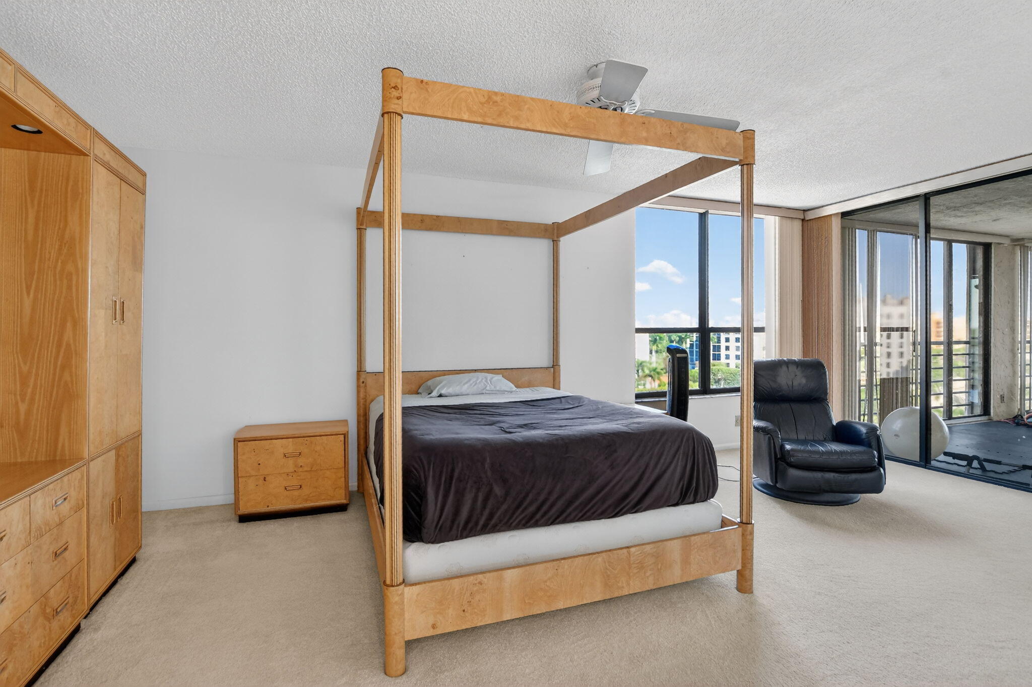 7564 Regency Lake Drive, Unit 701 Boca Raton, FL 33433 - Photo 26 of 47 a bedroom with a bed couch and a window