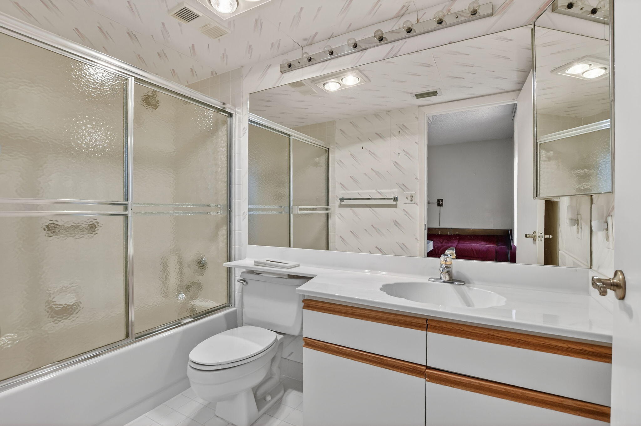 7564 Regency Lake Drive, Unit 701 Boca Raton, FL 33433 - Photo 36 of 47 a bathroom with a sink toilet and shower