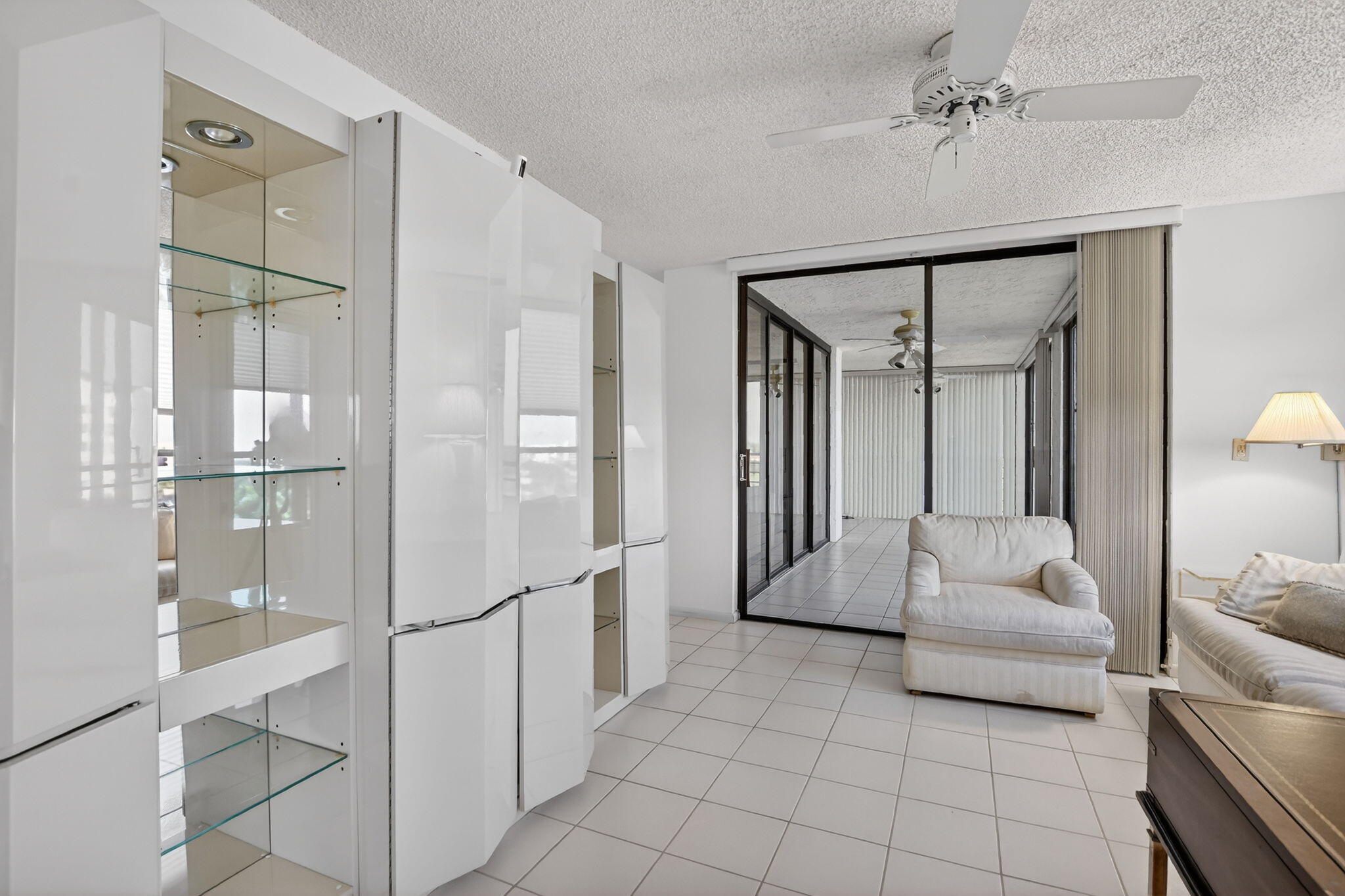 7564 Regency Lake Drive, Unit 701 Boca Raton, FL 33433 - Photo 39 of 47 a en suite bathroom with a shower sink and mirror