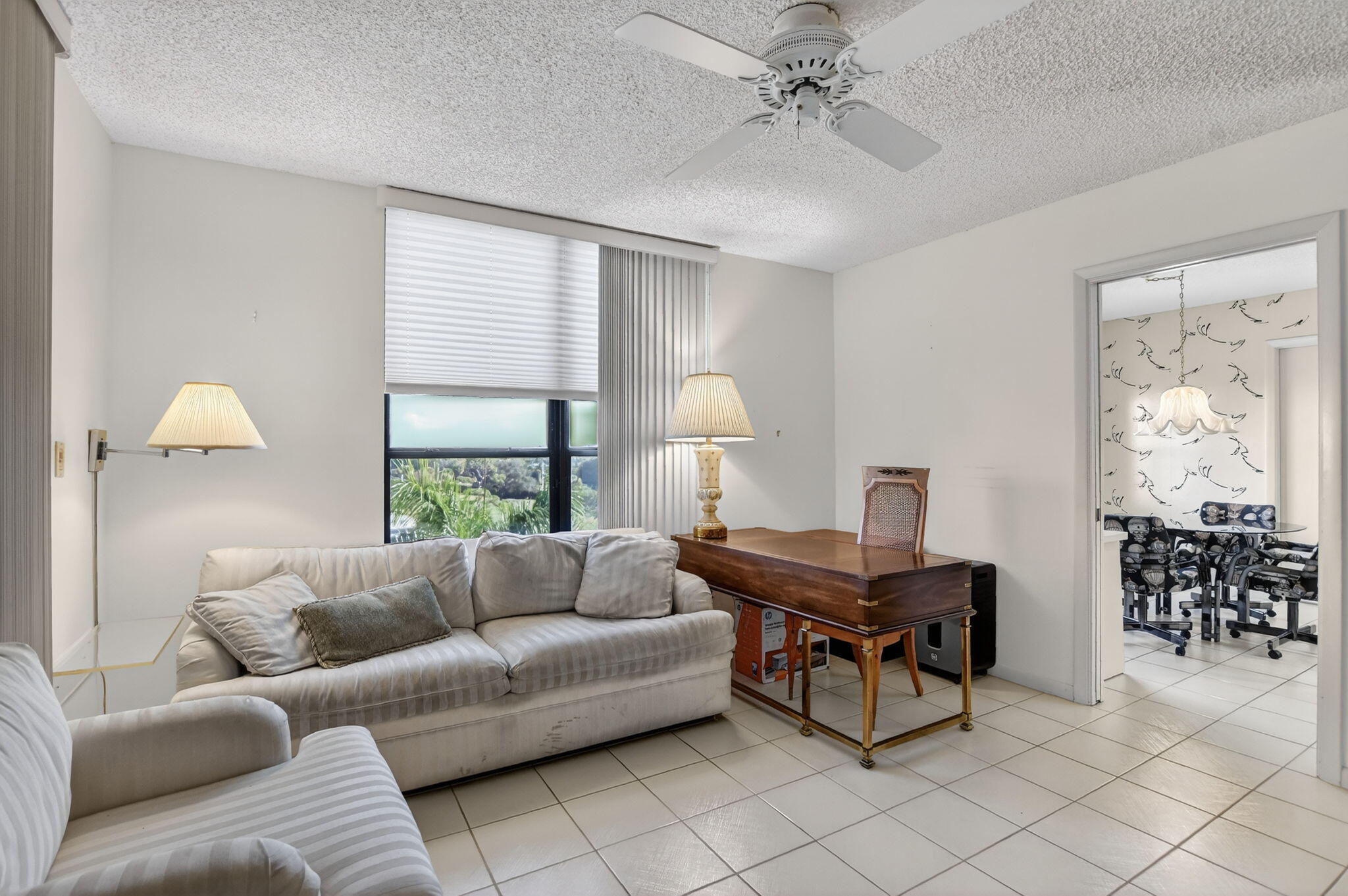 7564 Regency Lake Drive, Unit 701 Boca Raton, FL 33433 - Photo 40 of 47 a living room with furniture and window