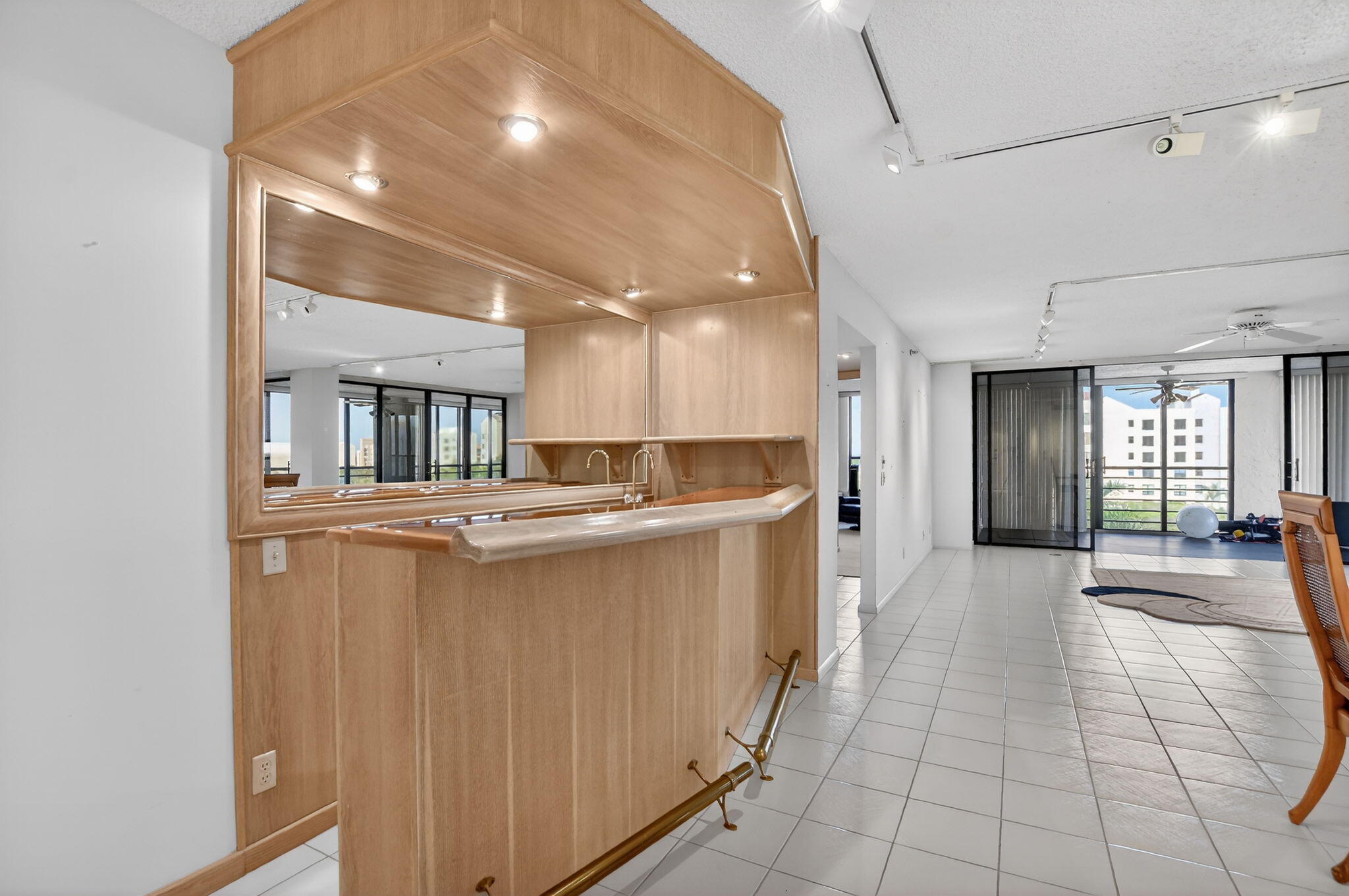 7564 Regency Lake Drive, Unit 701 Boca Raton, FL 33433 - Photo 10 of 47 a view of a hallway with furniture and a window