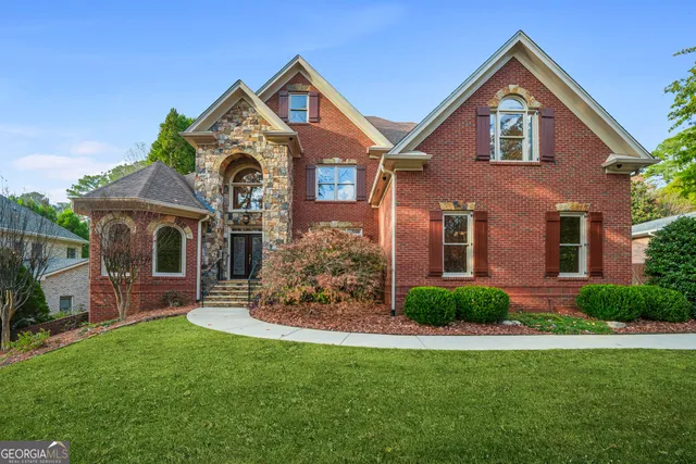 a front view of a house with a yard
