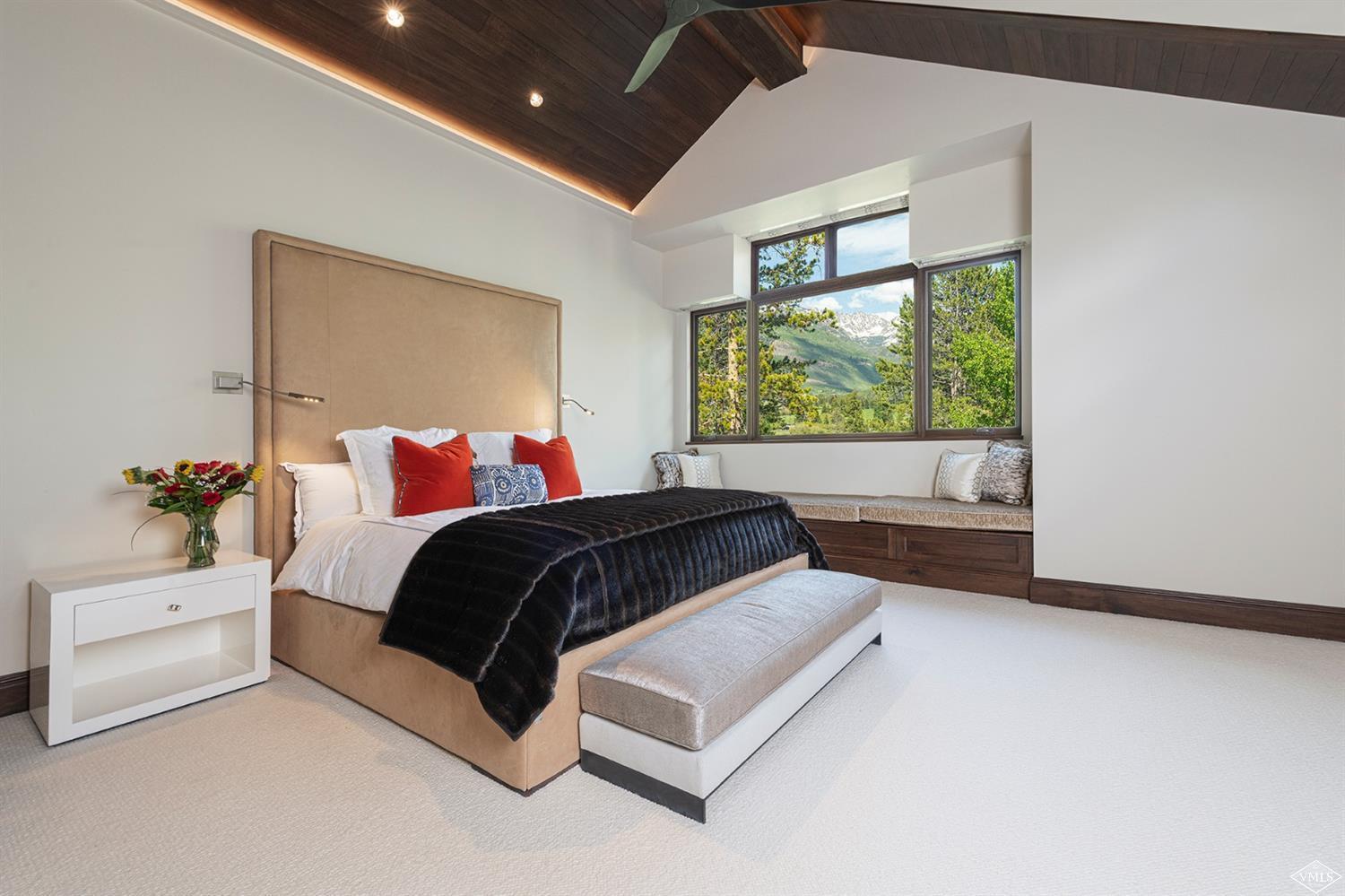 1183 Cabin Circle Vail, CO 81657 - Photo 11 of 19 a bedroom with a large bed and a window