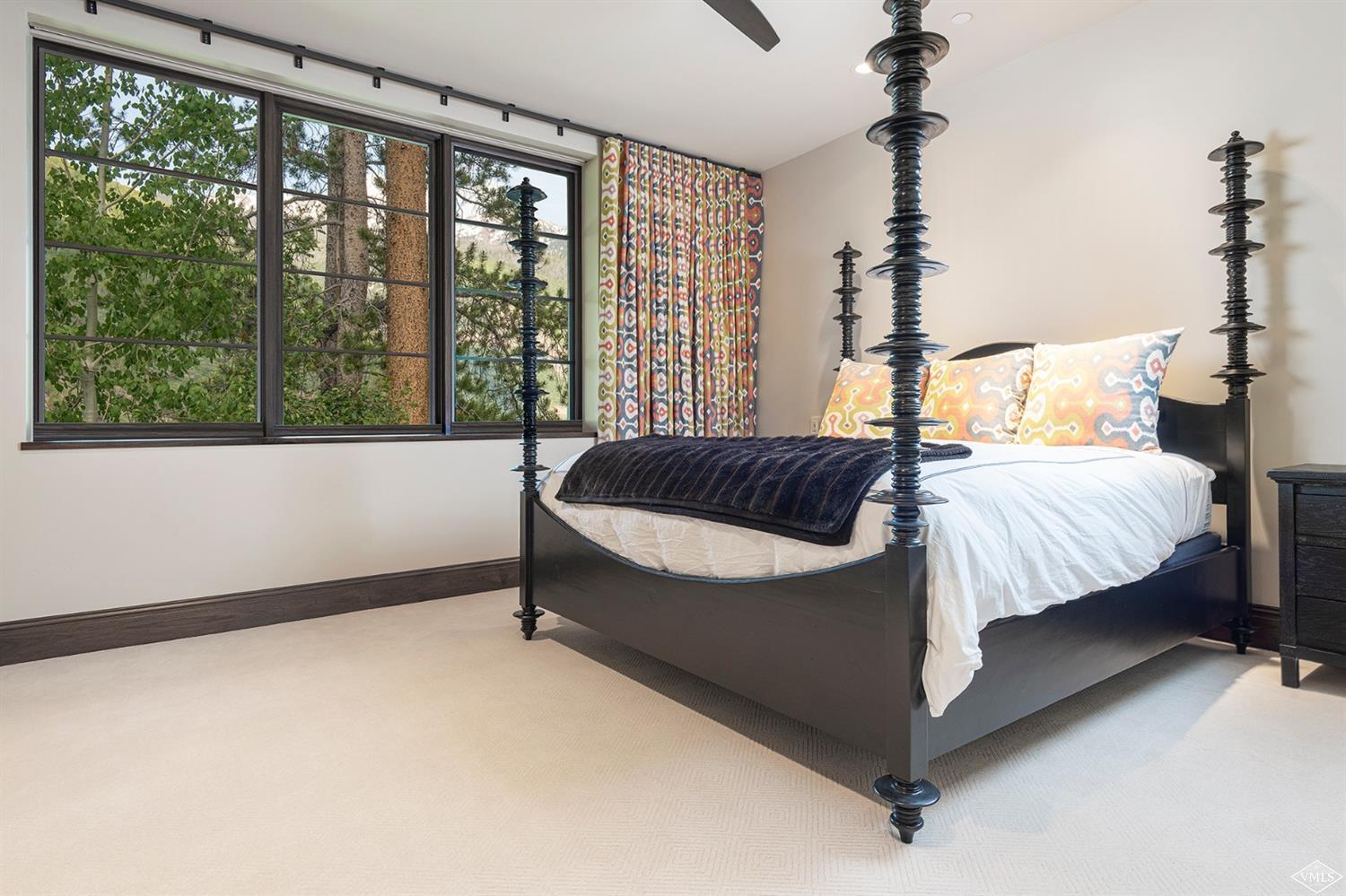 1183 Cabin Circle Vail, CO 81657 - Photo 12 of 19 a bedroom with a bed and window