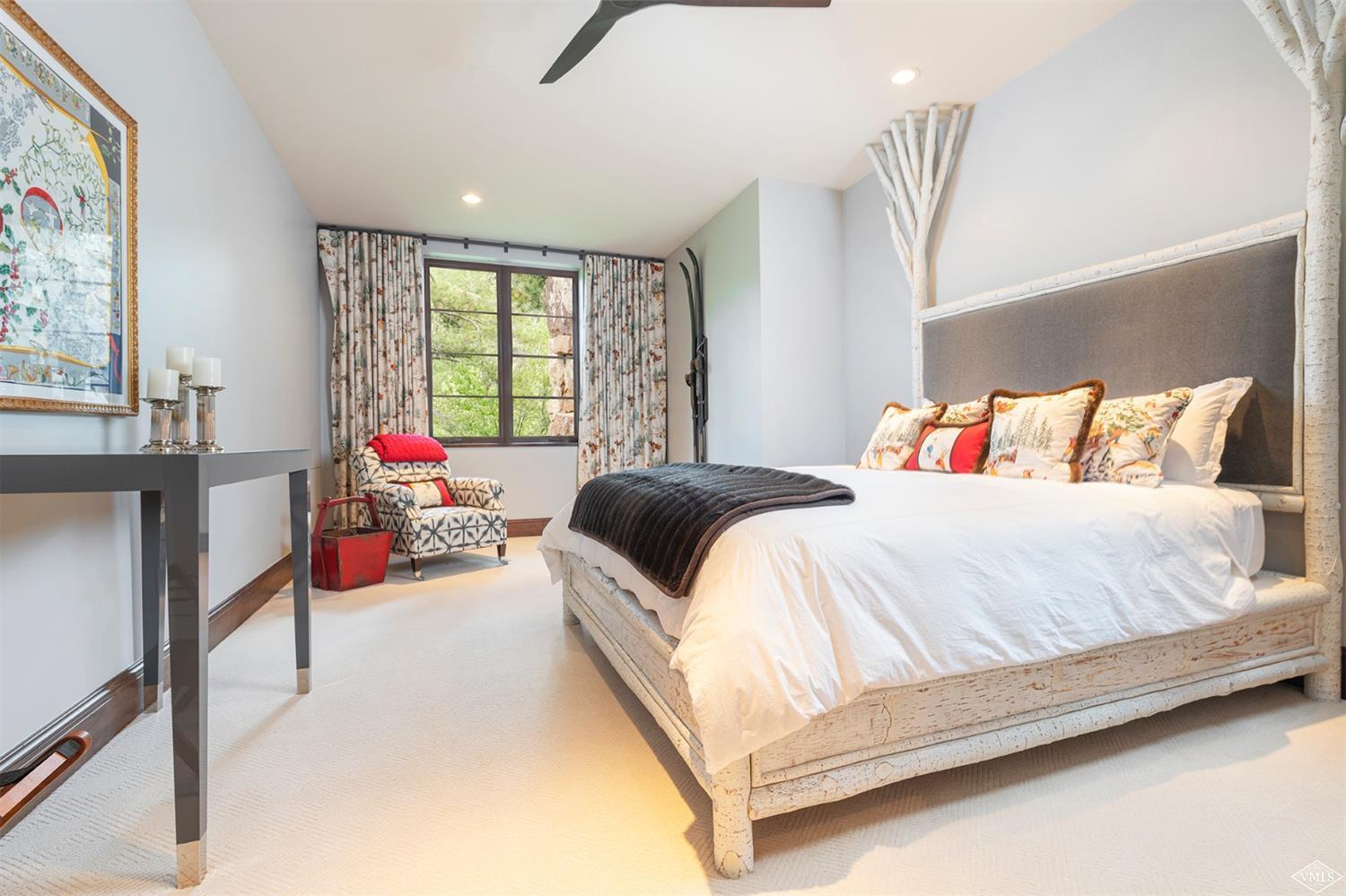 1183 Cabin Circle Vail, CO 81657 - Photo 13 of 19 a bedroom with a bed and a window