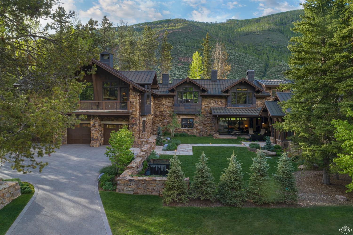 1183 Cabin Circle Vail, CO 81657 - Photo 17 of 19 a front view of a house with a garden