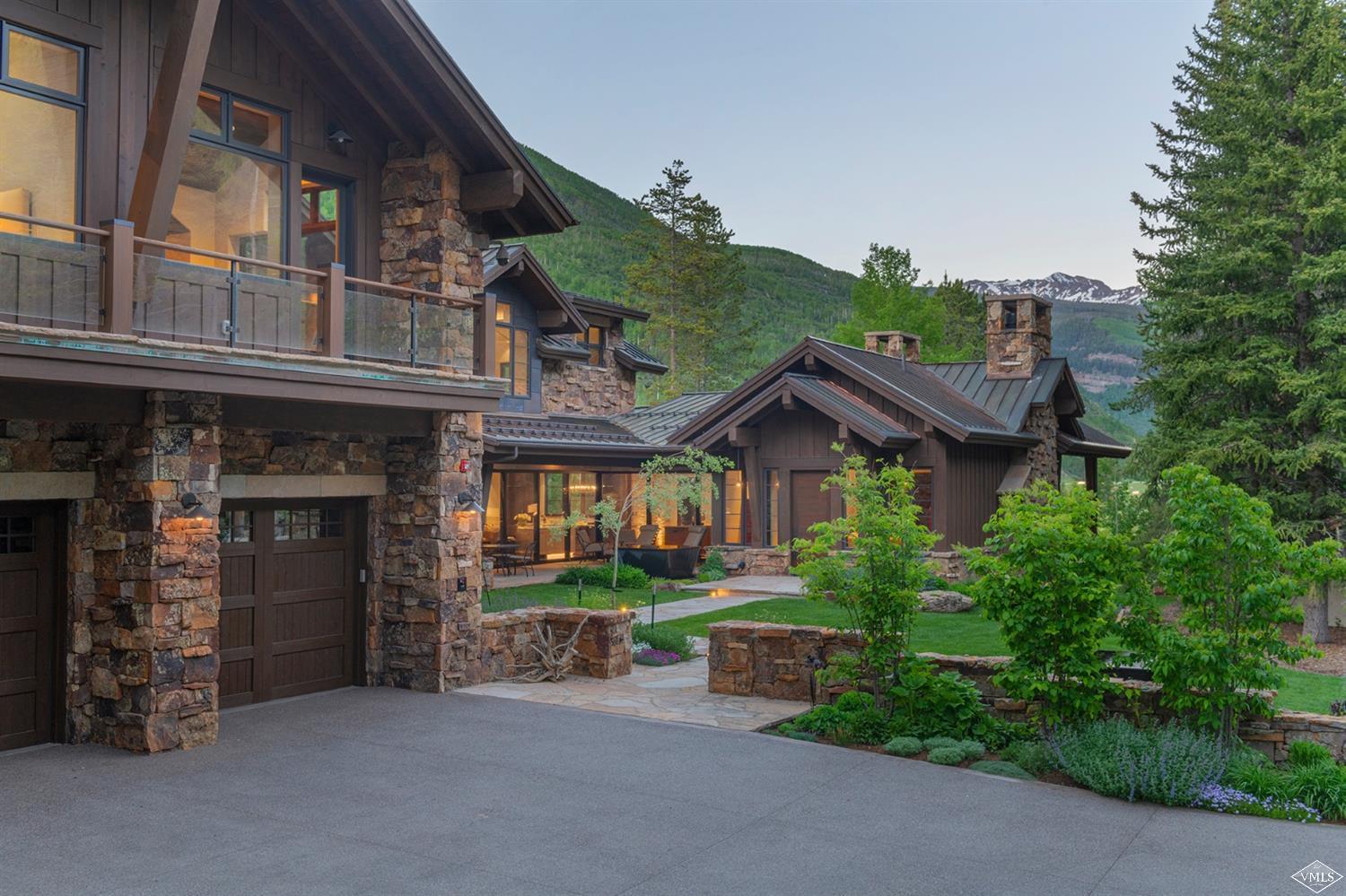 1183 Cabin Circle Vail, CO 81657 - Photo 19 of 19 a view of a big house with many windows and a small yard