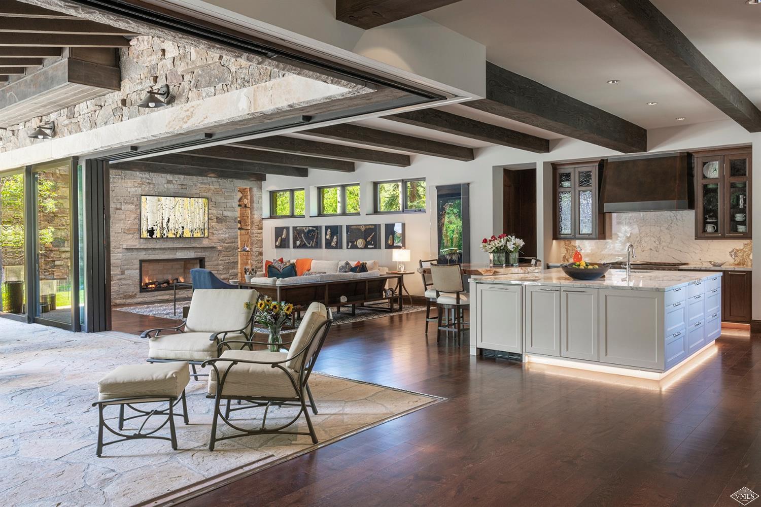 1183 Cabin Circle Vail, CO 81657 - Photo 5 of 19 a living room with furniture and a flat screen tv