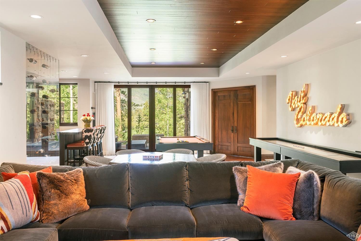 1183 Cabin Circle Vail, CO 81657 - Photo 8 of 19 a living room with furniture and large windows