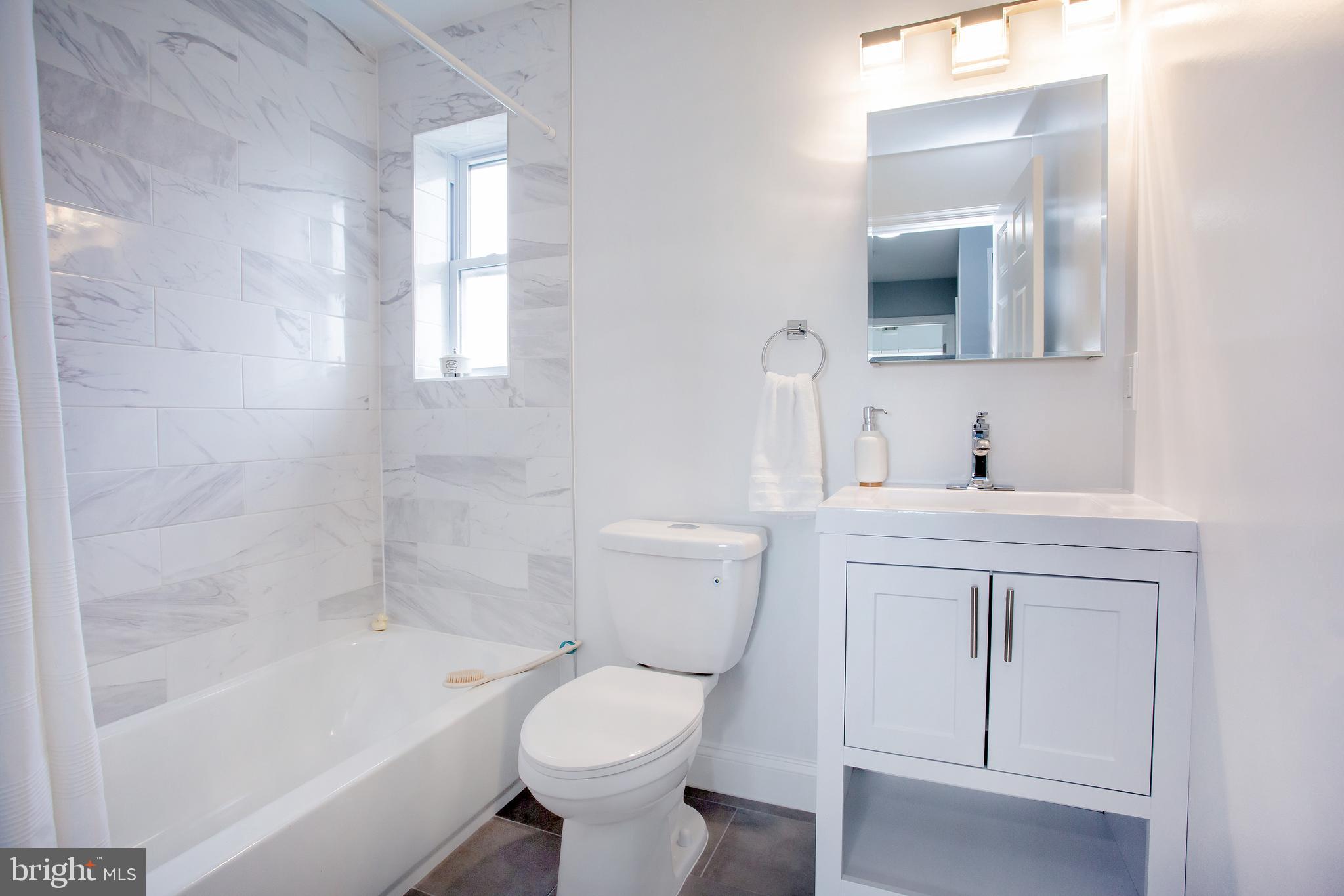 1364 W Street Northeast Washington, DC 20018 - Photo 46 of 80 2nd Bath has tub, basin, medicine cabinet.