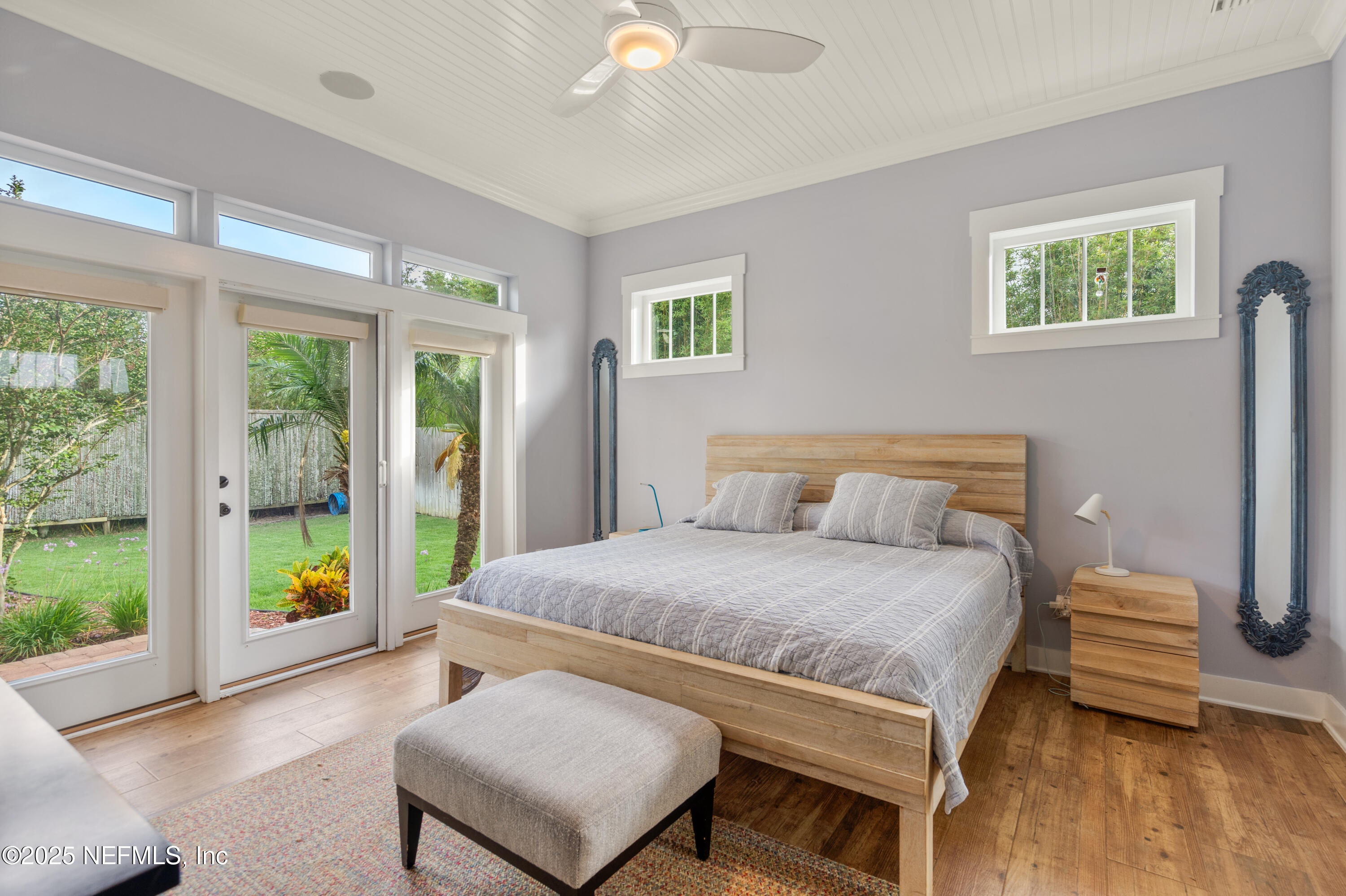 211 10th Street St. Augustine, FL 32080 - Photo 16 of 47 a bedroom with a bed and a couch