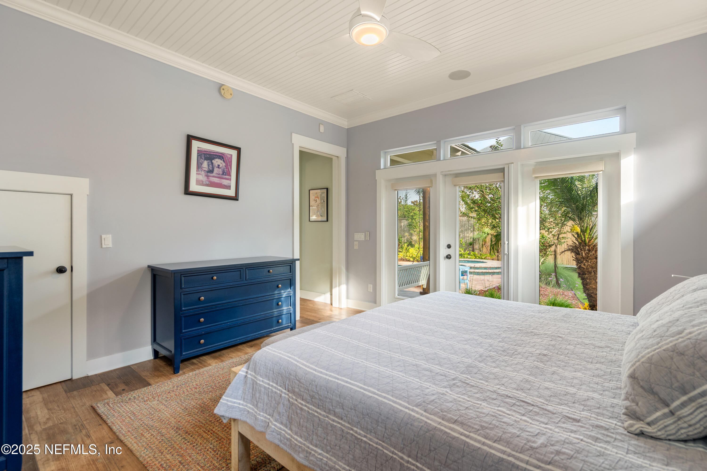 211 10th Street St. Augustine, FL 32080 - Photo 17 of 47 a bedroom with a bed and a large window