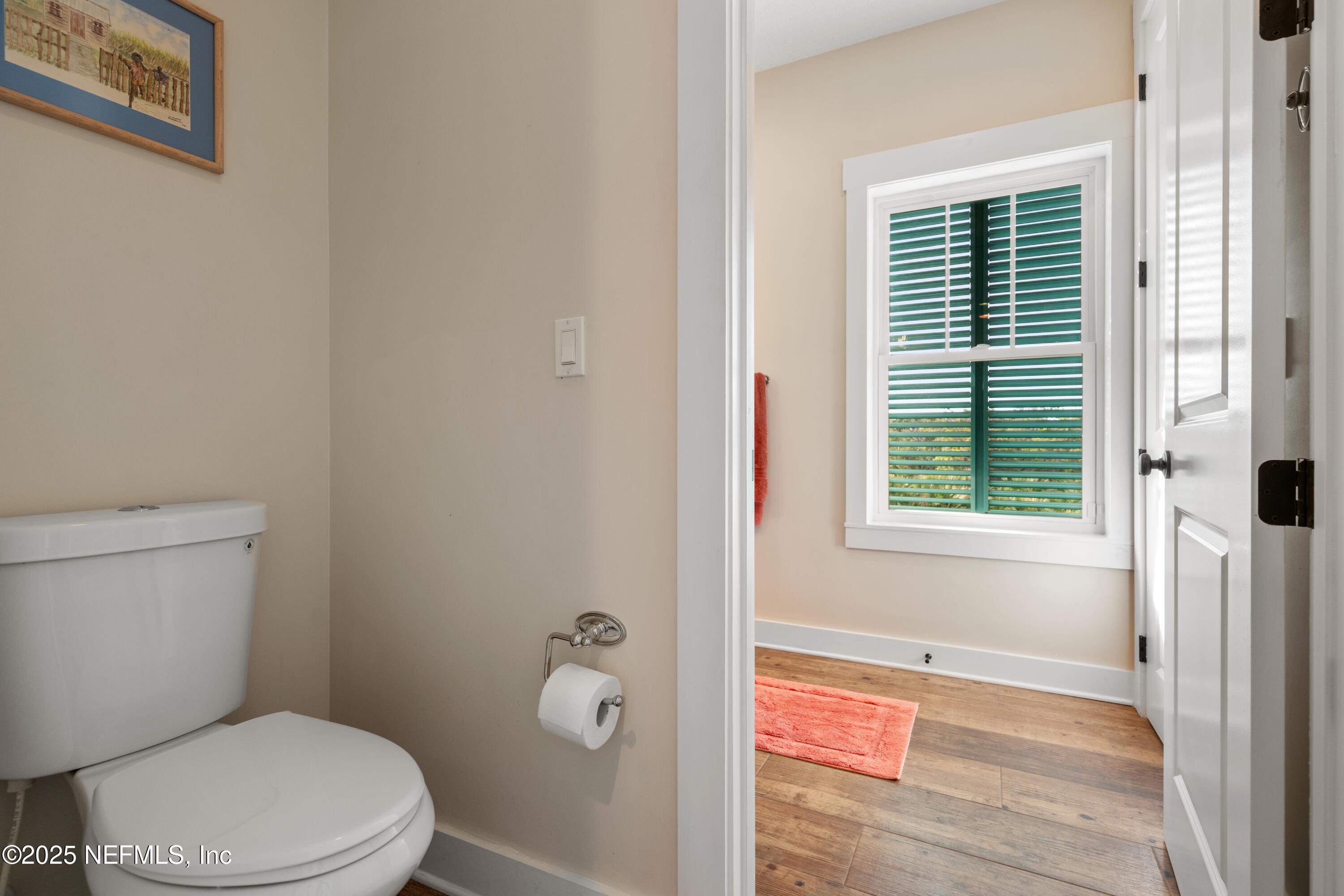 211 10th Street St. Augustine, FL 32080 - Photo 24 of 47 a white toilet sitting next to a bathroom sink