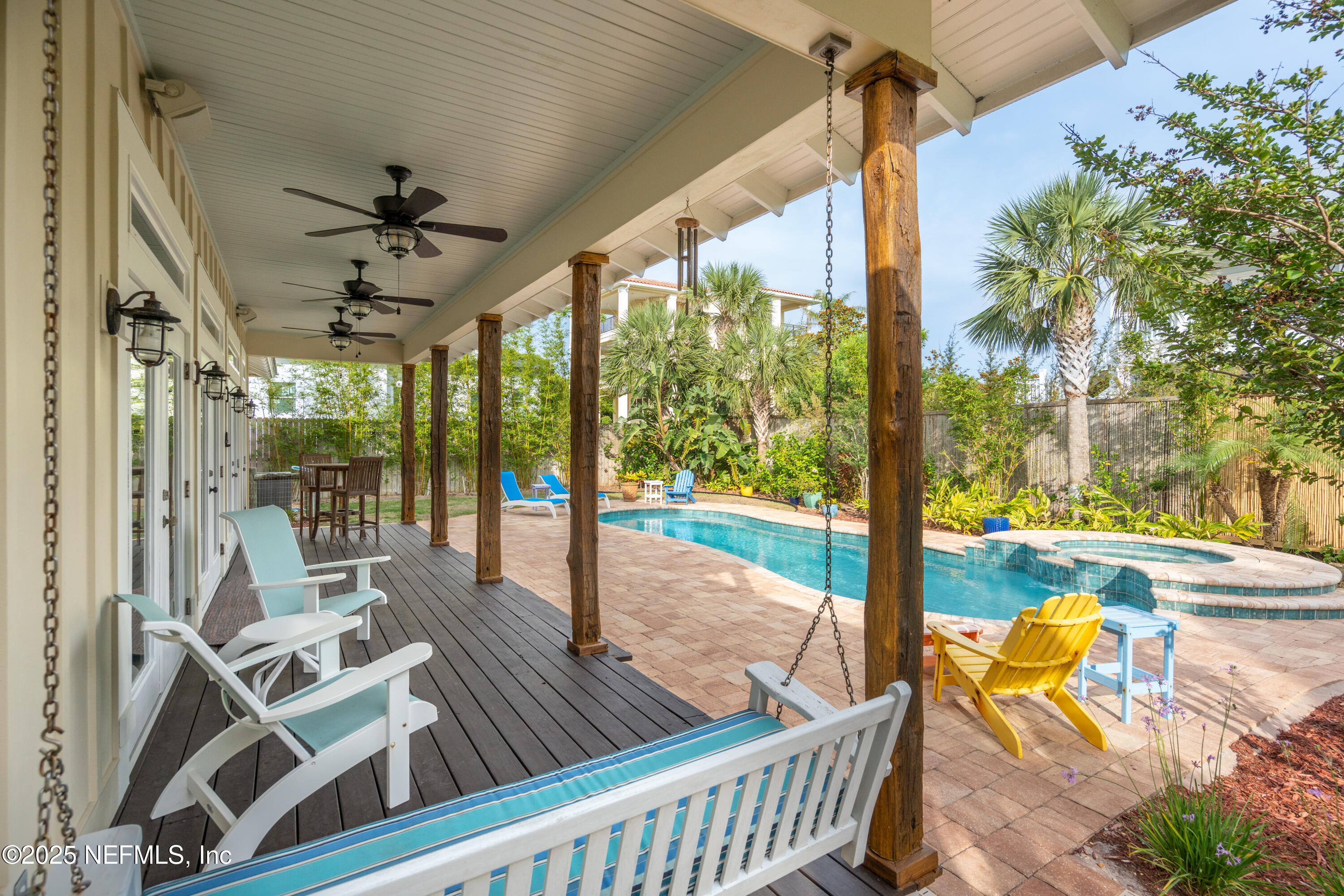 211 10th Street St. Augustine, FL 32080 - Photo 28 of 47 a view of a patio with a table chairs and garden