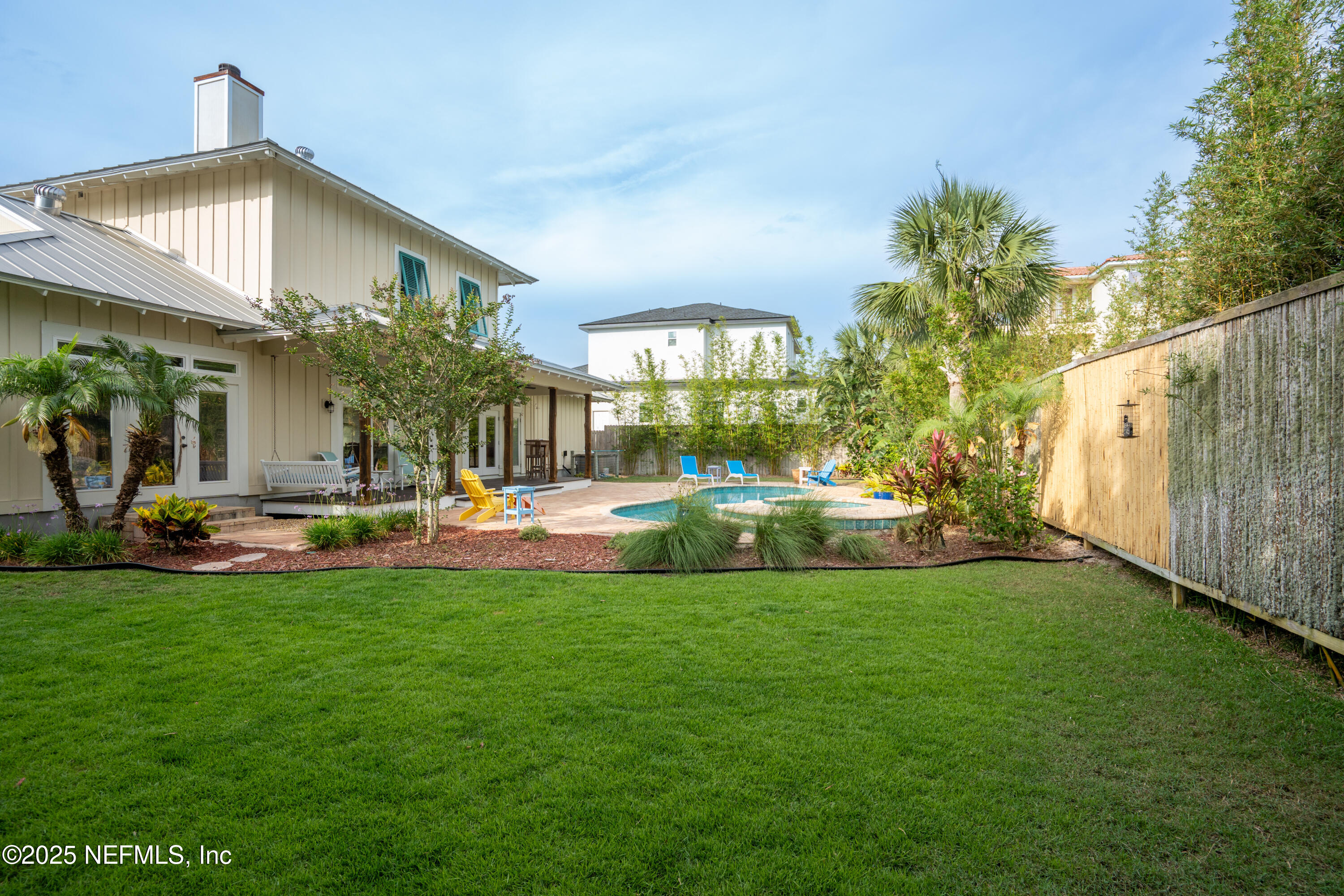 211 10th Street St. Augustine, FL 32080 - Photo 29 of 47 a view of a house with a yard and sitting area