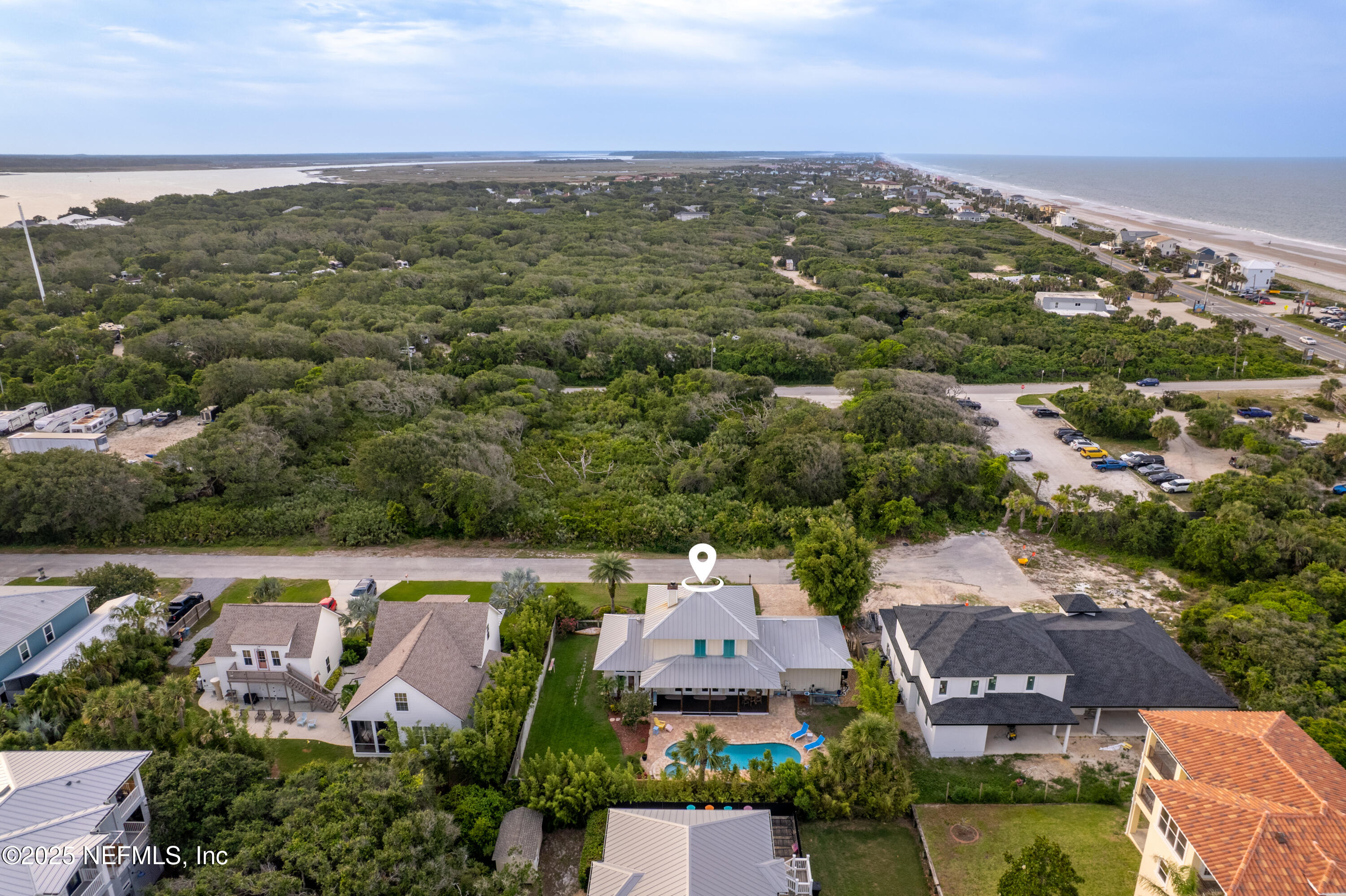 211 10th Street St. Augustine, FL 32080 - Photo 3 of 47 an aerial view of a house with a lake view