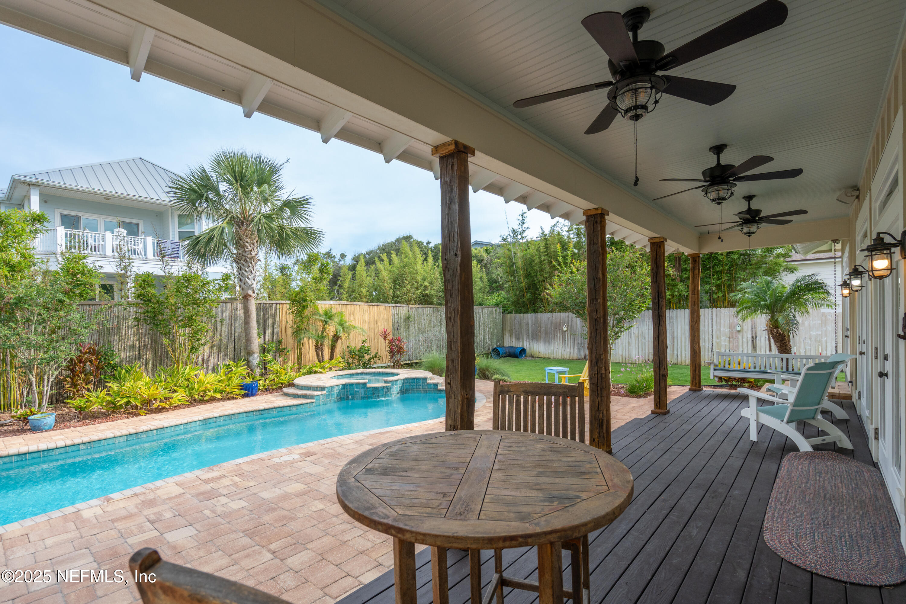 211 10th Street St. Augustine, FL 32080 - Photo 39 of 47 a view of a porch with furniture and a yard