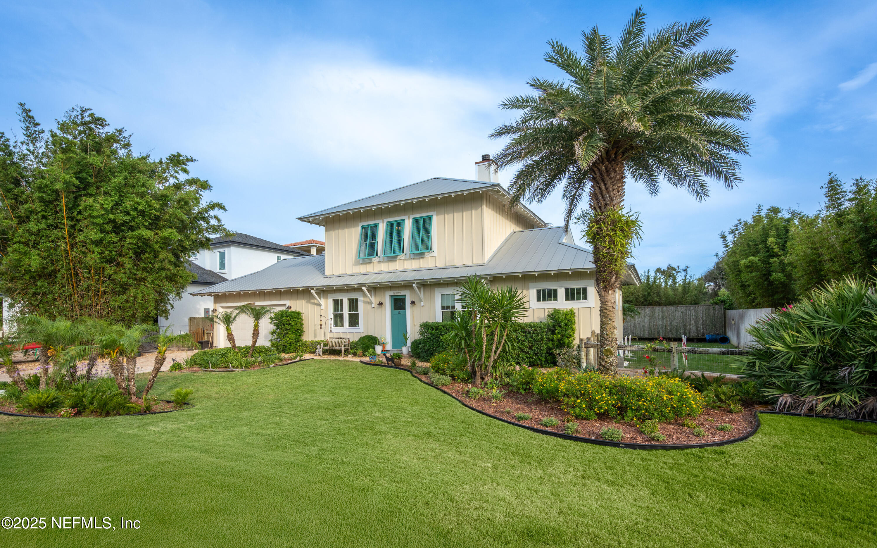 211 10th Street St. Augustine, FL 32080 - Photo 43 of 47 a front view of a house with a garden
