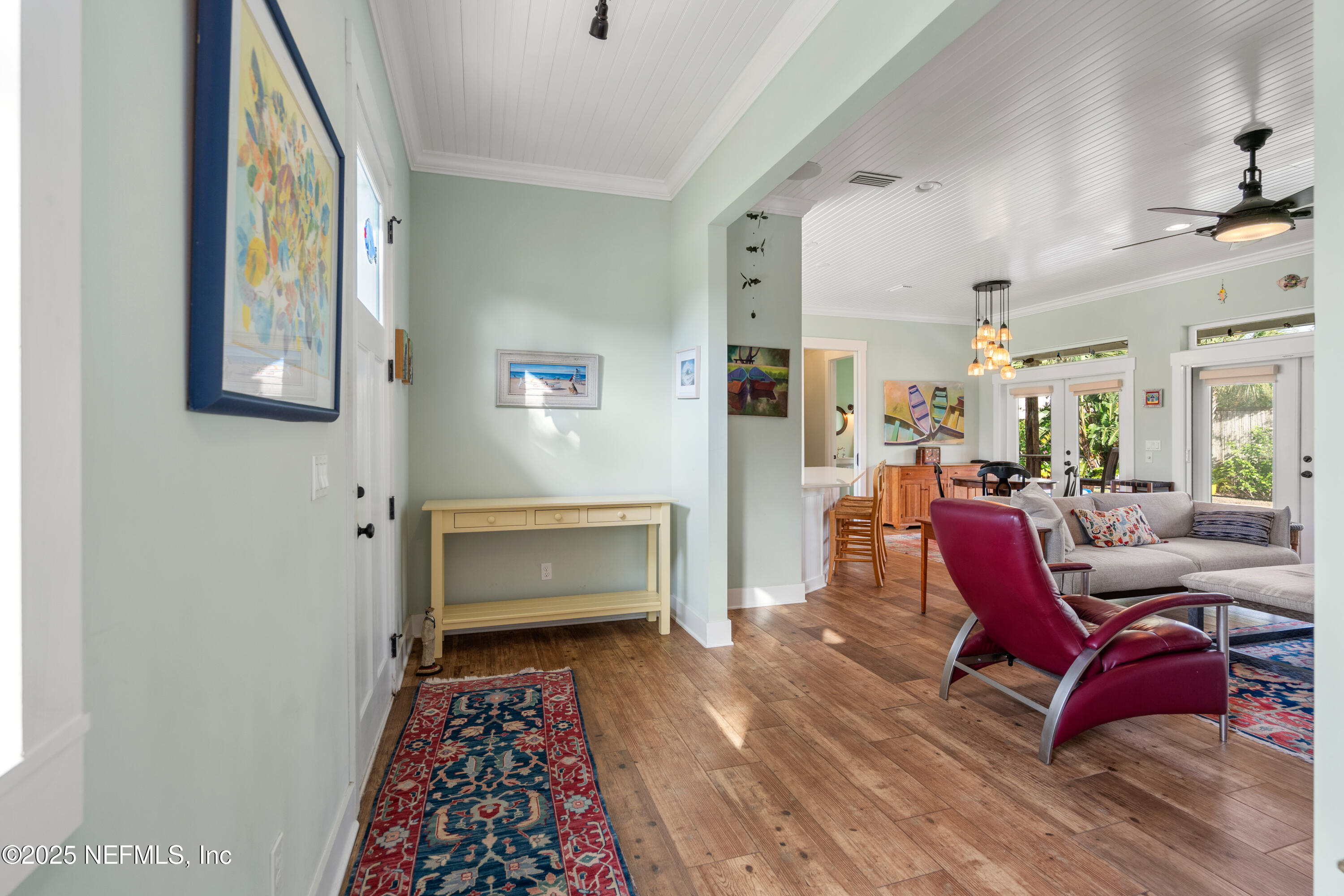 211 10th Street St. Augustine, FL 32080 - Photo 5 of 47 a living room with furniture and a rug
