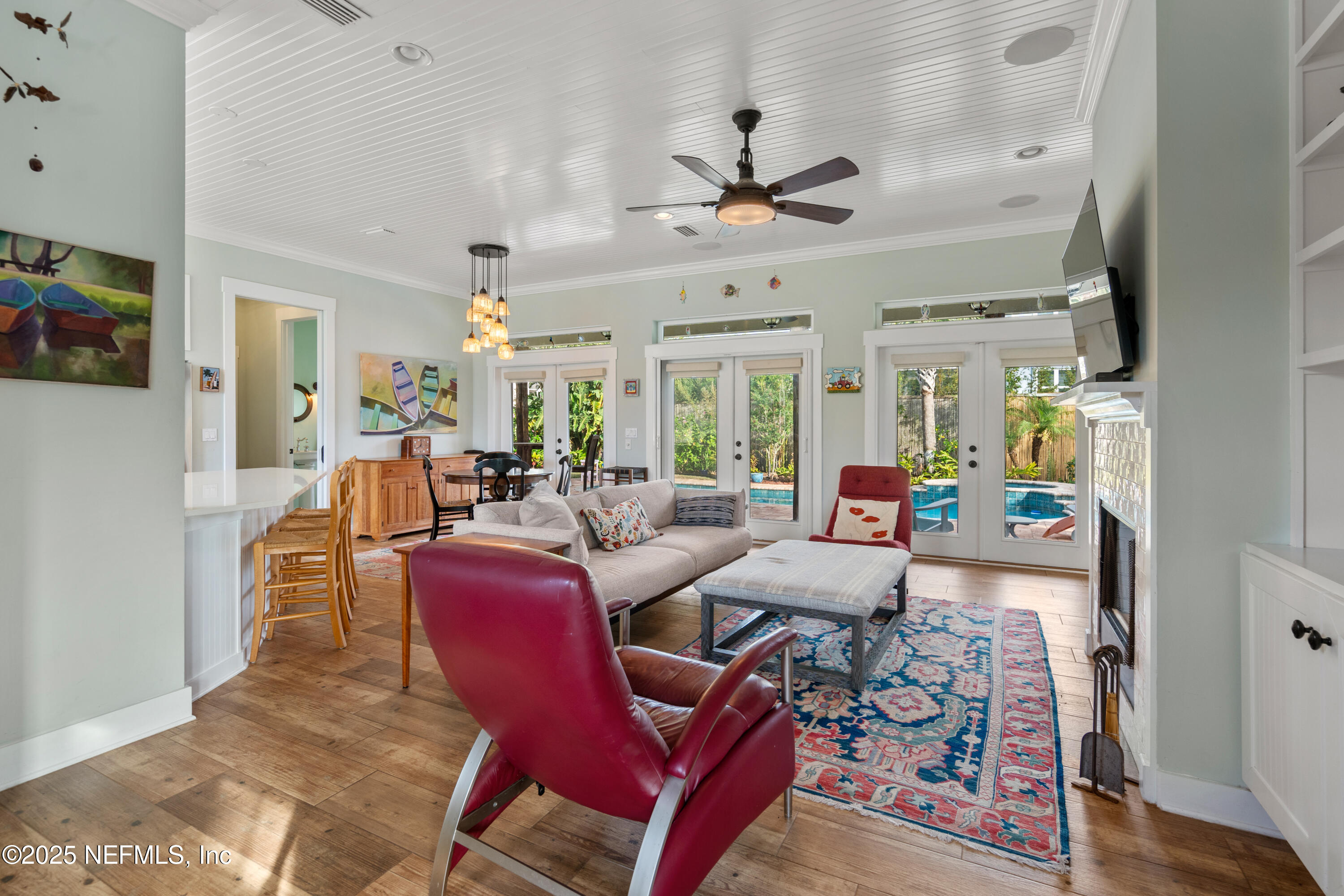 211 10th Street St. Augustine, FL 32080 - Photo 6 of 47 a view of a dining room with furniture window and wooden floor