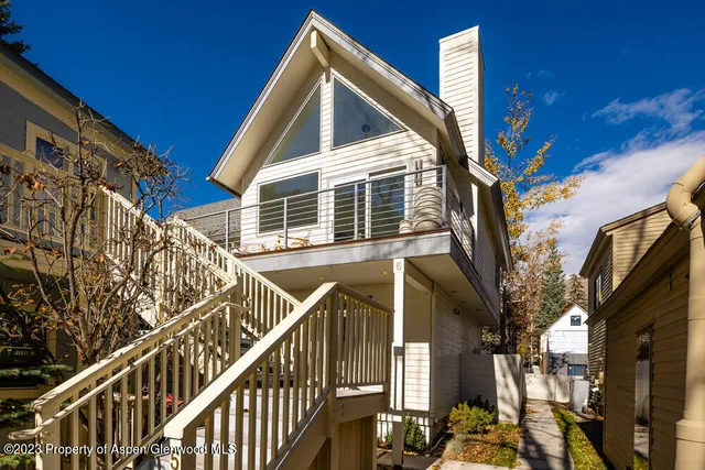 a view of a house with a tree