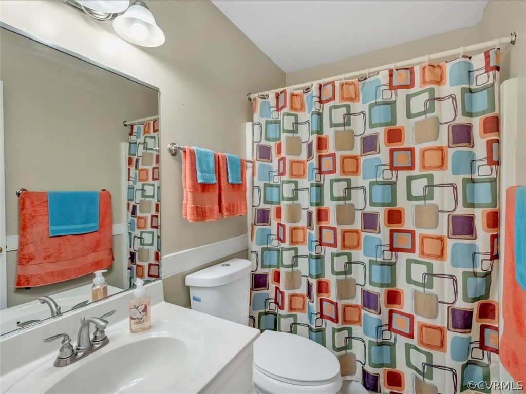7024 Pointer Ridge Road Midlothian, VA 23112 - Photo 12 of 24 a bathroom with a sink toilet and shower