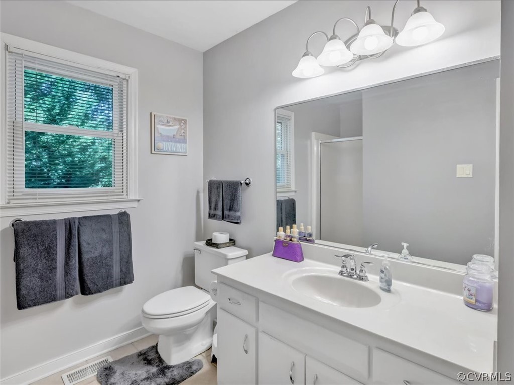 7024 Pointer Ridge Road Midlothian, VA 23112 - Photo 17 of 24 a bathroom with a toilet sink and mirror
