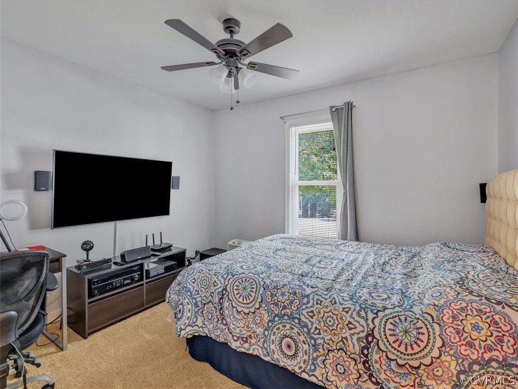 7024 Pointer Ridge Road Midlothian, VA 23112 - Photo 18 of 24 a bedroom with a bed and a flat screen tv
