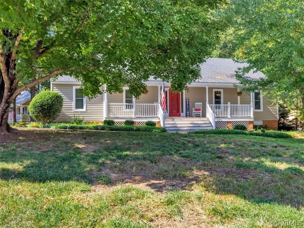 7024 Pointer Ridge Road Midlothian, VA 23112 - Photo 2 of 24 a front view of a house with a yard