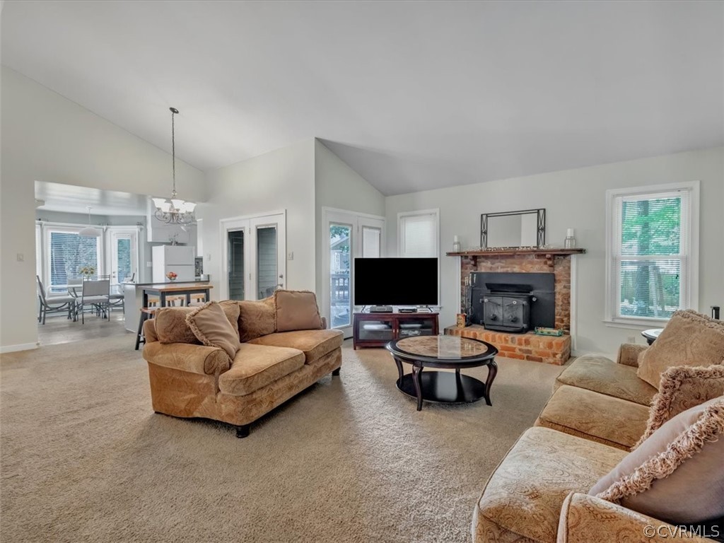 7024 Pointer Ridge Road Midlothian, VA 23112 - Photo 5 of 24 a living room with furniture a flat screen tv and a fireplace