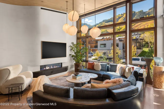 a living room with furniture fireplace and a flat screen tv