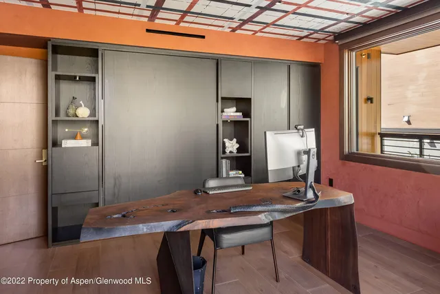 a view of a workspace with furniture