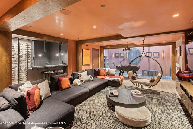 a bathroom with a granite countertop sink and a shower