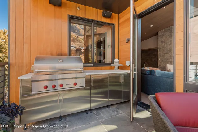 a outdoor space with the ceiling glass door and shower