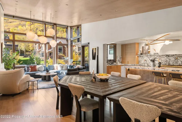 a view of a dining room with furniture and window
