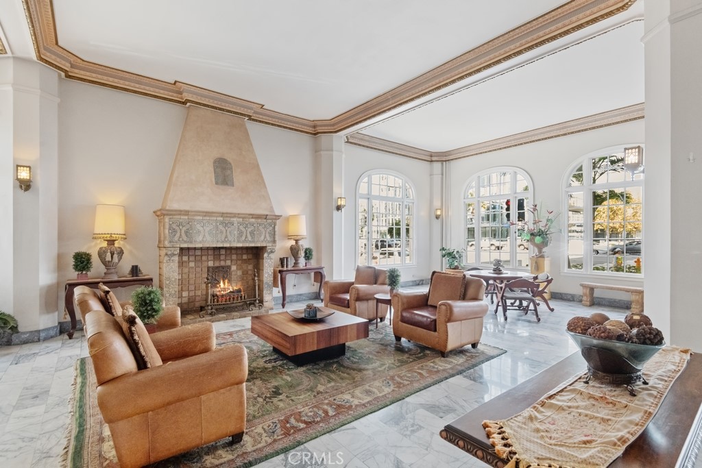 360 West Ocean Boulevard, Unit 706 Long Beach, CA 90802 - Photo 11 of 22 a living room with furniture and a fireplace