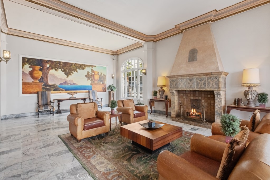 360 West Ocean Boulevard, Unit 706 Long Beach, CA 90802 - Photo 12 of 22 a living room with furniture a fireplace and a floor to ceiling window