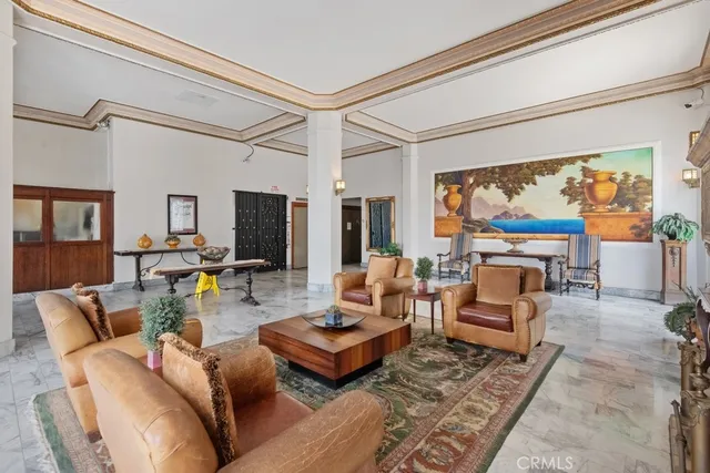 a living room with furniture a large window and a flat screen tv